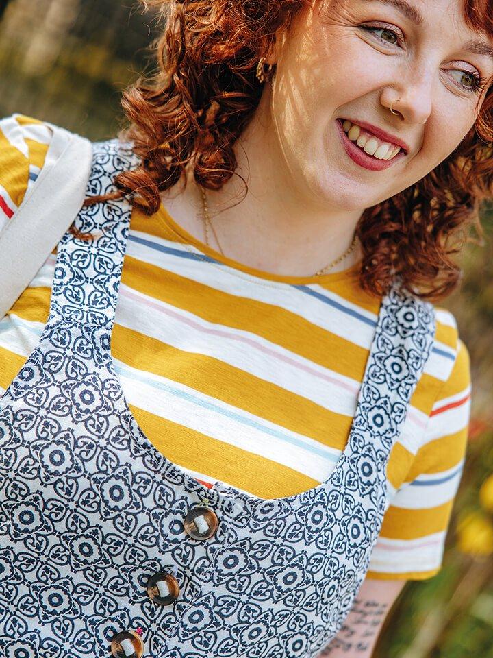 woman in stripy top and dungarees